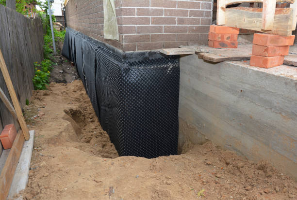 SJ Waterproofing Pros technician performing targeted Waterproofing assessment in Bowersville, OH